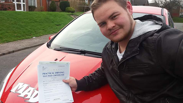 Learner showing their practical driving test pass certificate